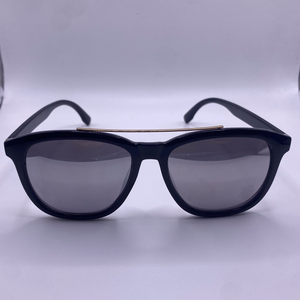 Woman’s large black glasses